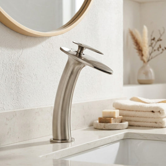 Lagomel single-hole waterfall vessel sink faucet in brushed gold, brushed nickel, oil-rubbed bronze, chrome, gunmetal, set in a Modern/Contemporary bathroom