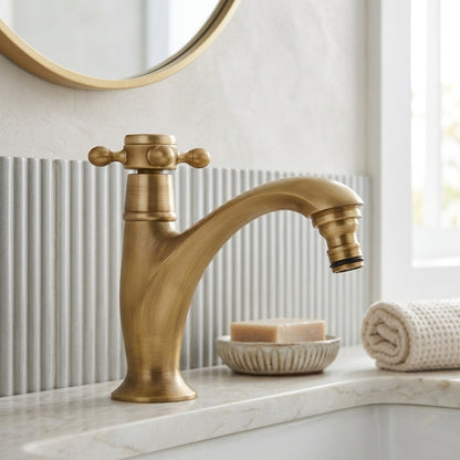 Lagomel single-hole bathroom faucet in antique brass, set in a Traditional/Classic/Vintage/Retro bathroom