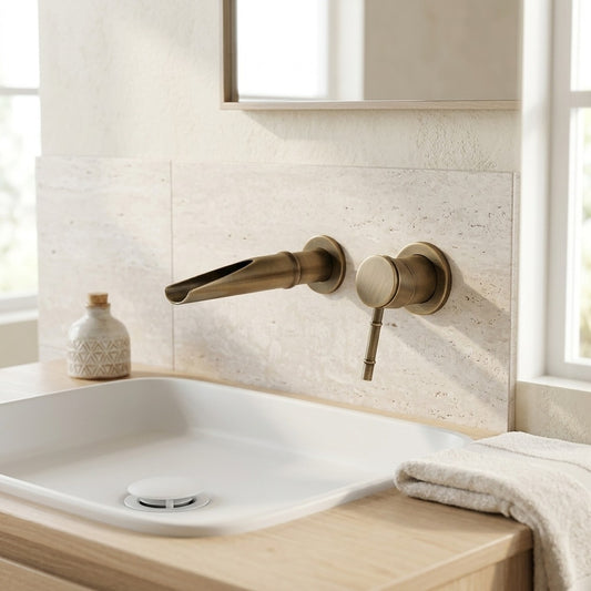 Lagomel waterfall single-handle wall-mount bathroom faucet in antique brass, brushed gold, set in a Modern/Vintage/Retro bathroom
