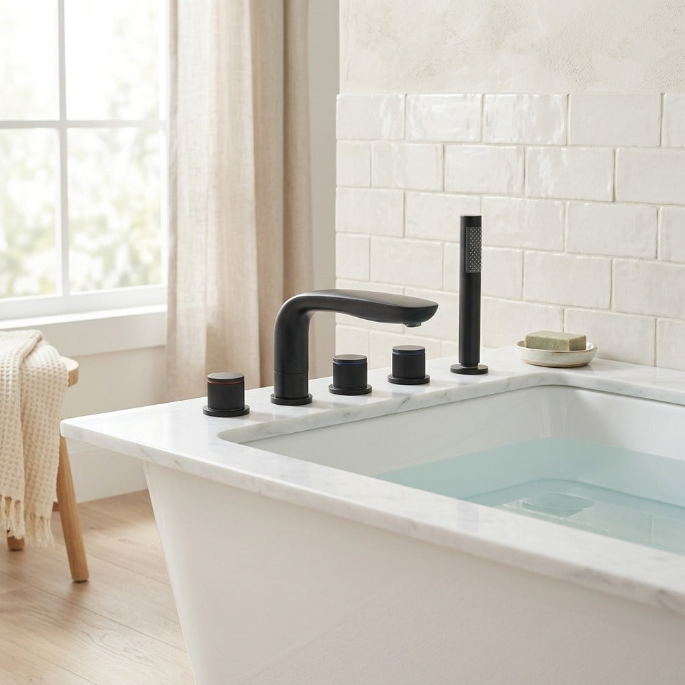 Lagomel deck-mount tub filler in matte black, brushed gold, two-tone / mixed finish, set in a Modern/Minimalist bathroom