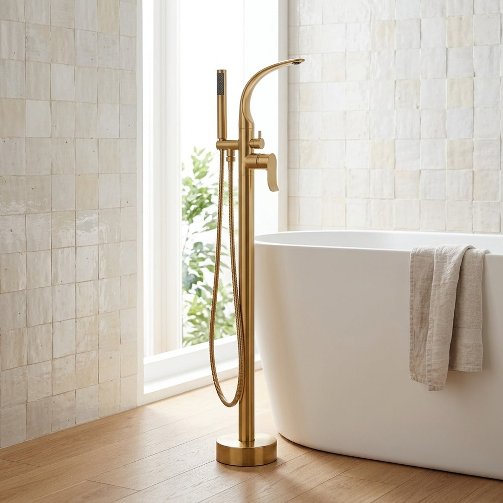 Lagomel freestanding tub filler in brushed gold, set in a Modern/Contemporary bathroom