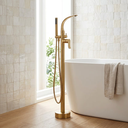 Lagomel freestanding tub filler in brushed gold, set in a Modern/Contemporary bathroom
