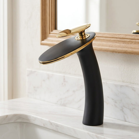 Lagomel single-hole waterfall vessel sink faucet in two-tone / mixed finish, set in a Contemporary bathroom