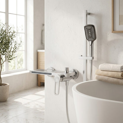 Lagomel waterfall single-handle wall-mount tub filler, set in a Modern/Minimalist bathroom