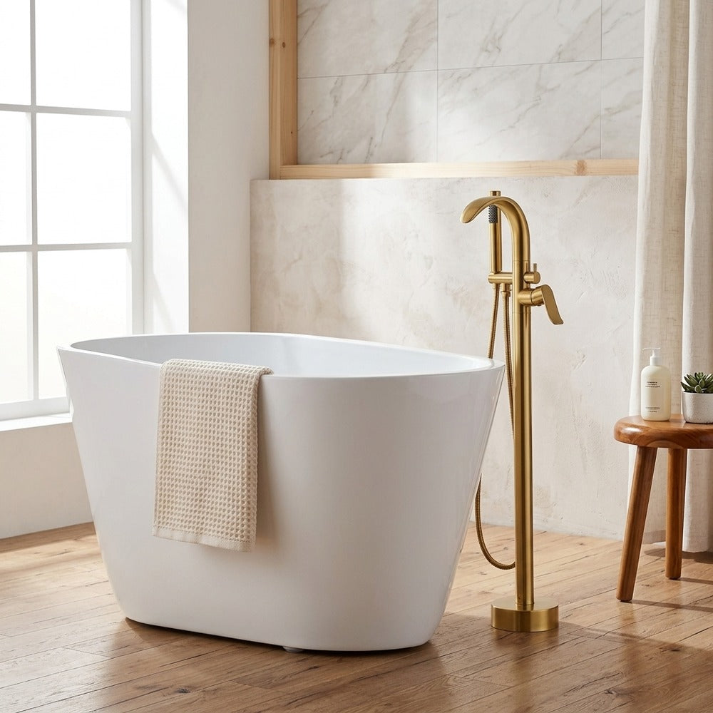 Lagomel single-handle freestanding tub filler in brushed gold, set in a Modern/Minimalist bathroom