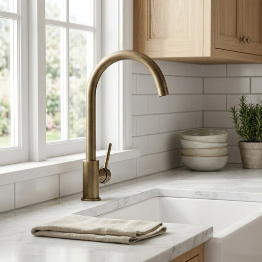 Lagomel single-handle kitchen faucet in antique brass, set in a Modern/Contemporary kitchen