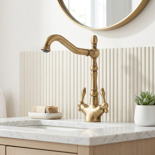 Lagomel double-handle single-hole bathroom faucet in antique brass, set in a Vintage/Retro bathroom