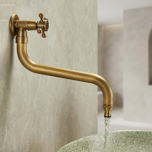 Lagomel wall-mounted single-handle outdoor faucet in antique brass, set in a Vintage/Retro/Traditional/Classic bathroom