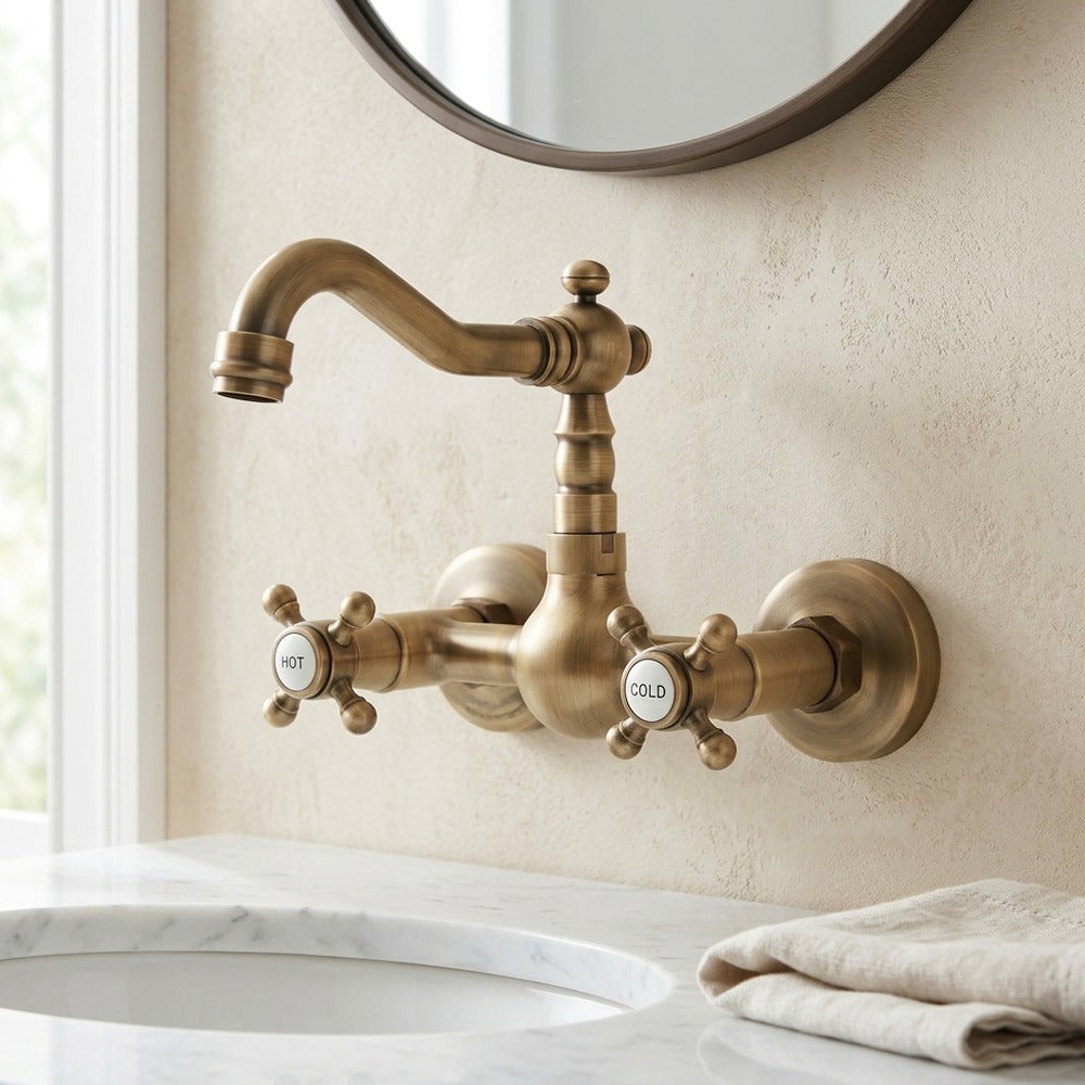 Lagomel two-handle wall-mount bathroom faucet in antique brass, set in a Vintage/Retro bathroom