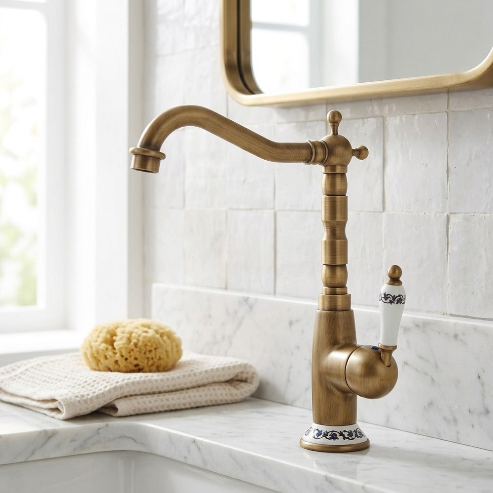 Lagomel single-hole vessel sink faucet in antique brass, set in a Vintage/Retro/Traditional/Classic bathroom