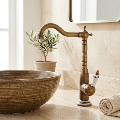 Lagomel single-hole single-handle vessel sink faucet in antique brass, set in a Traditional/Classic/Vintage/Retro bathroom