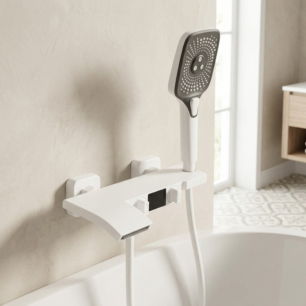 Lagomel waterfall wall-mount tub filler in matte black, matte white, chrome, gunmetal, two-tone / mixed finish, set in a Modern/Contemporary bathroom