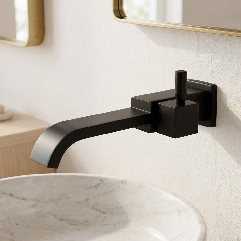 Lagomel single-handle wall-mount bathroom faucet in matte black, chrome, set in a Contemporary bathroom