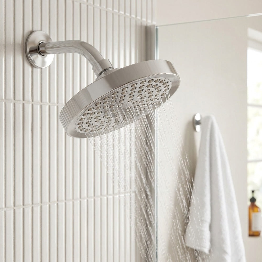 Lagomel wall-mounted fixed shower head, set in a Modern/Contemporary bathroom
