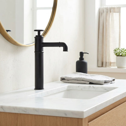 Lagomel single-hole vessel sink faucet in matte black, set in a Contemporary/Industrial bathroom