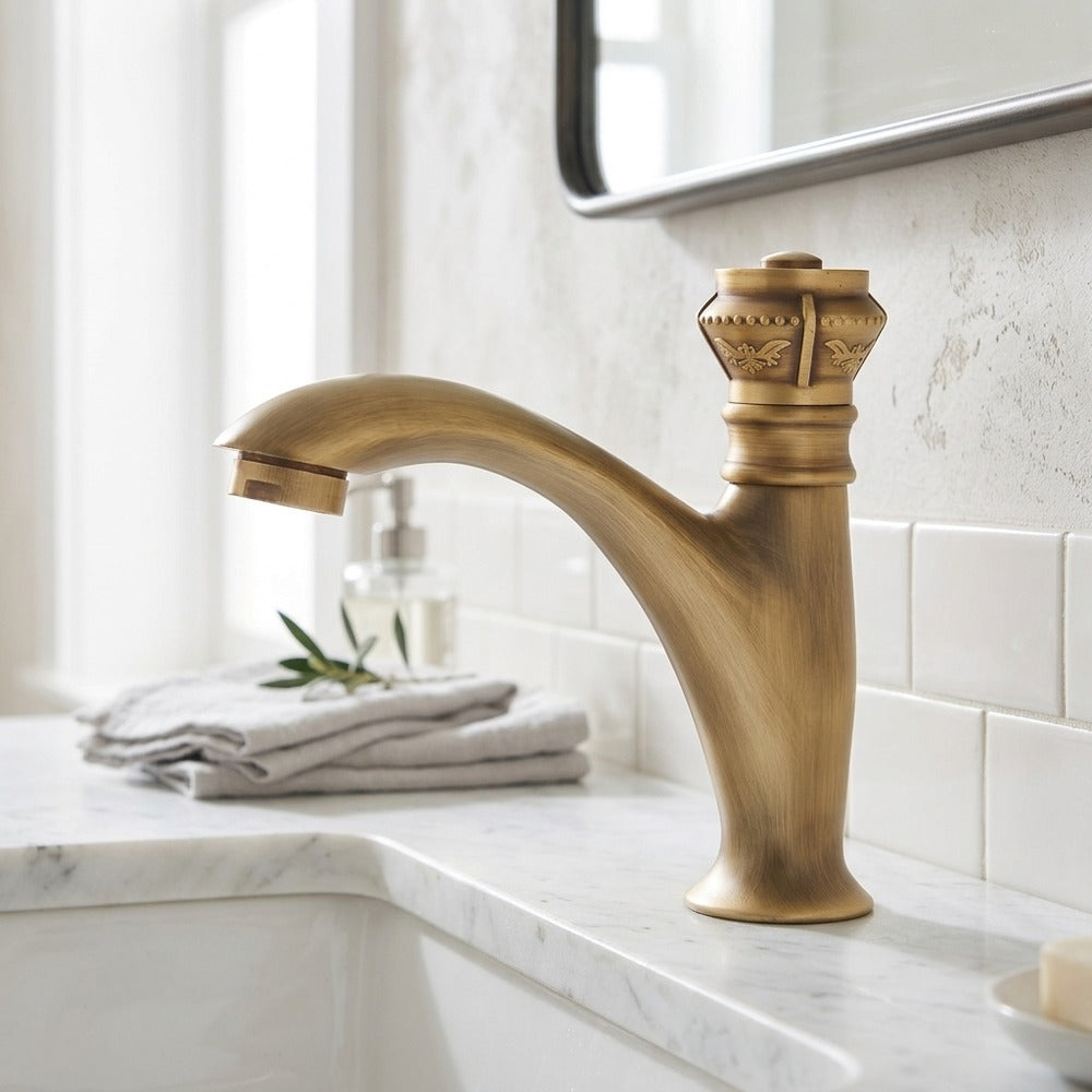 Lagomel single-hole bathroom faucet in antique brass, set in a Traditional/Classic/Vintage/Retro bathroom