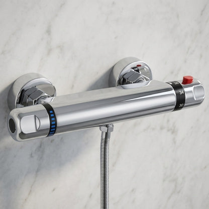 Lagomel wall-mounted shower valve in chrome, set in a Contemporary bathroom