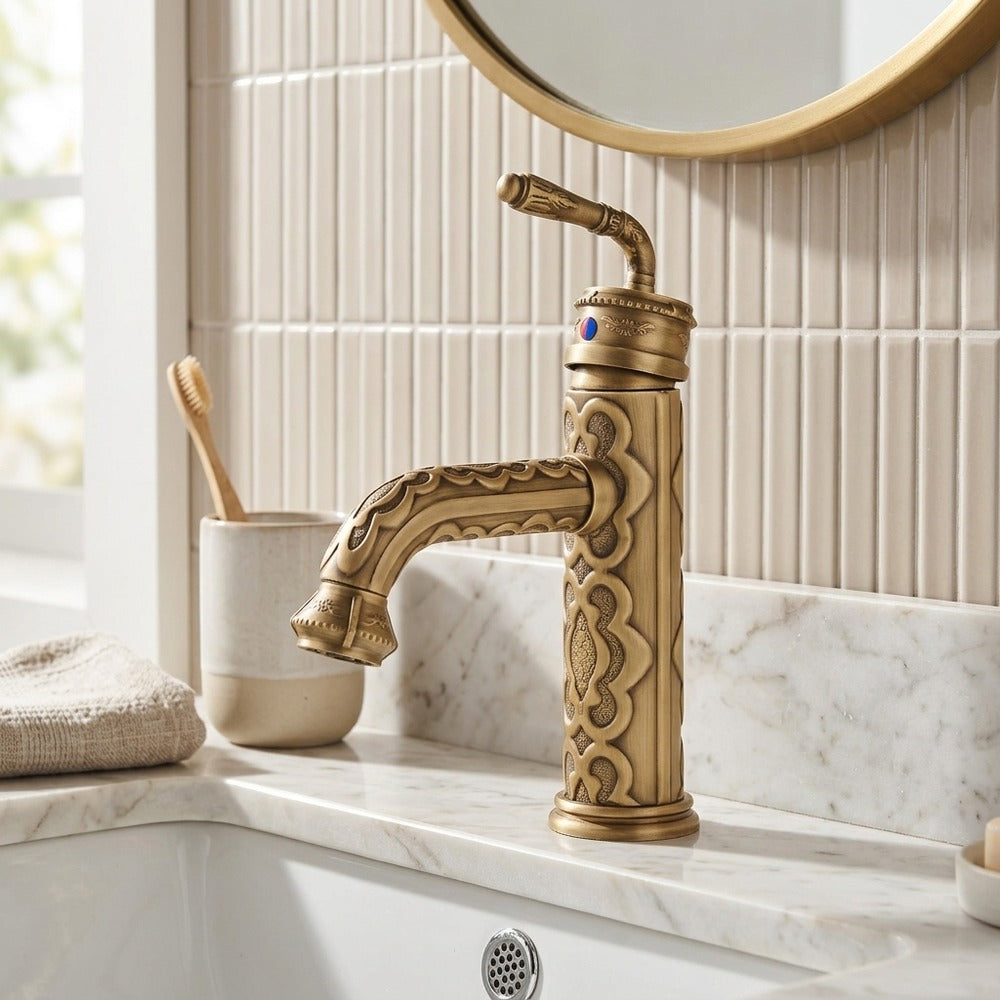 Lagomel single-hole bathroom faucet in antique brass, set in a Traditional/Classic/Vintage/Retro bathroom