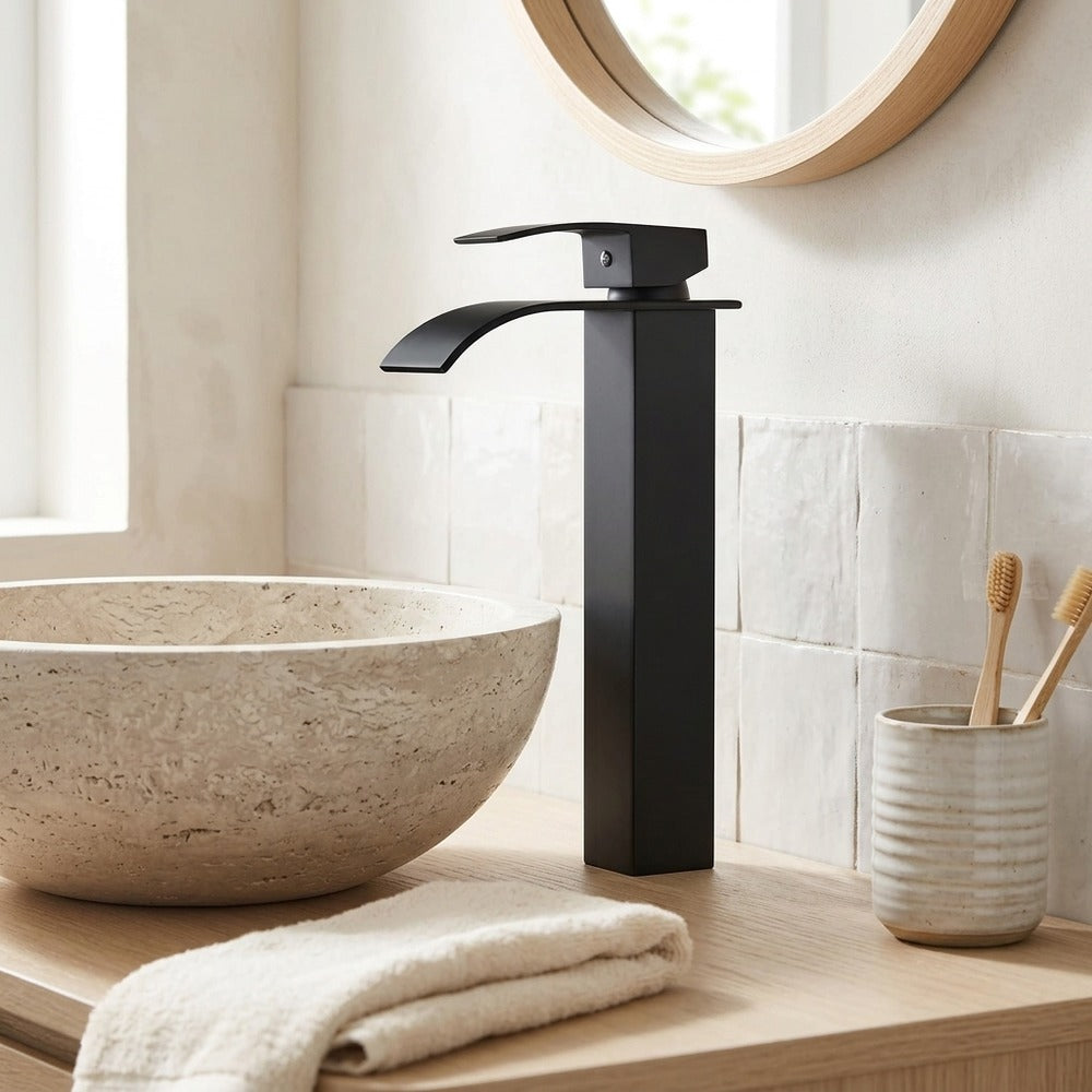 Lagomel vessel sink waterfall single-hole bathroom faucet in matte black, polished gold, set in a Modern/Contemporary bathroom