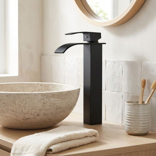 Lagomel vessel sink waterfall single-hole bathroom faucet in matte black, polished gold, set in a Modern/Contemporary bathroom