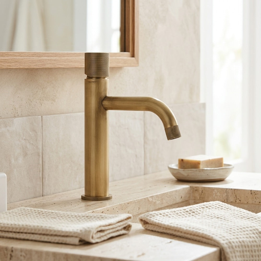 Lagomel single-hole bathroom faucet in antique brass, set in a Traditional/Classic/Vintage/Retro bathroom