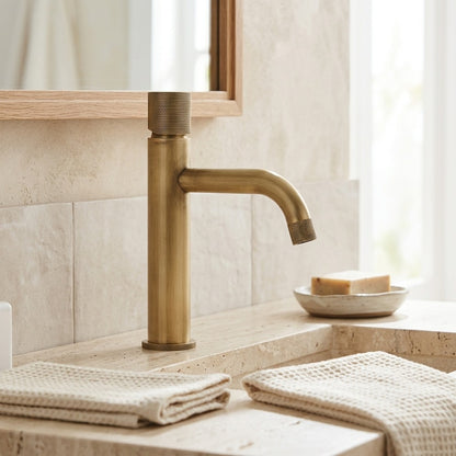 Lagomel single-hole bathroom faucet in antique brass, set in a Traditional/Classic/Vintage/Retro bathroom
