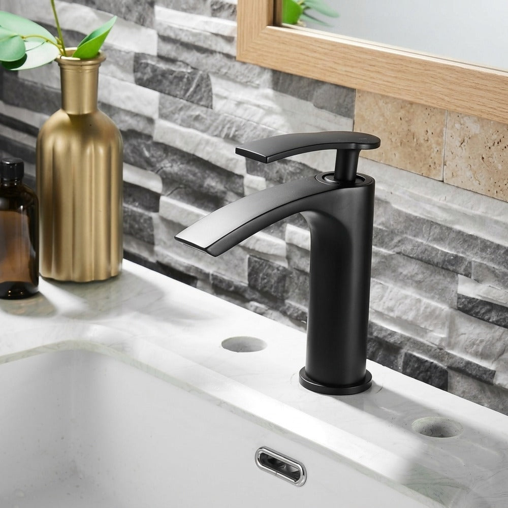 Lagomel single-hole waterfall vessel sink faucet, set in a Modern/Contemporary bathroom