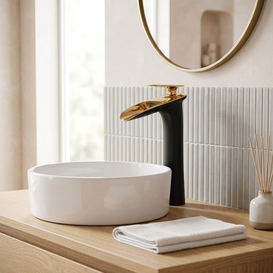 Lagomel single-hole waterfall vessel sink faucet in two-tone / mixed finish, polished gold, matte black, matte, set in a Modern/Minimalist/Contemporary bathroom
