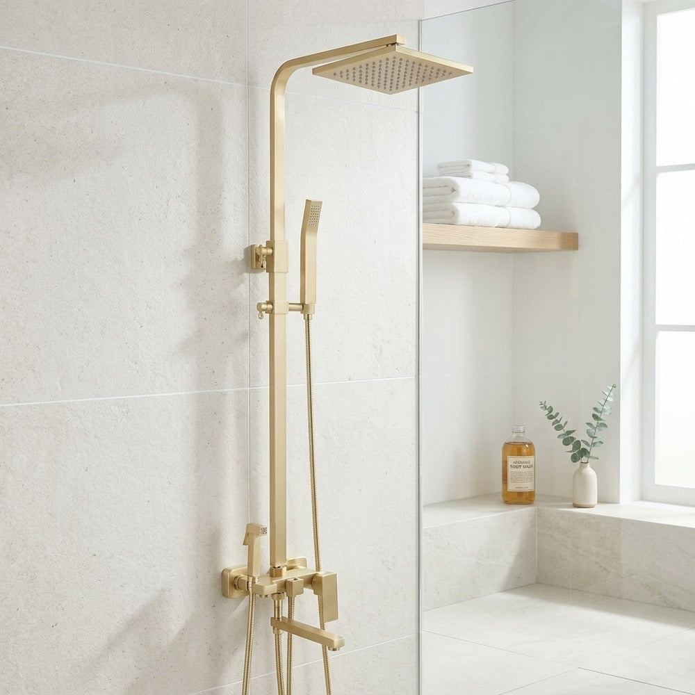 Lagomel wall-mounted tub and shower system in brushed gold, set in a Contemporary/Vintage/Retro bathroom