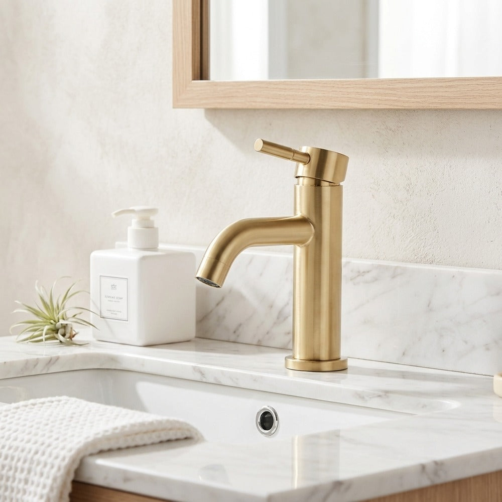 Lagomel waterfall single-hole bathroom faucet in brushed gold, set in a Modern/Contemporary bathroom