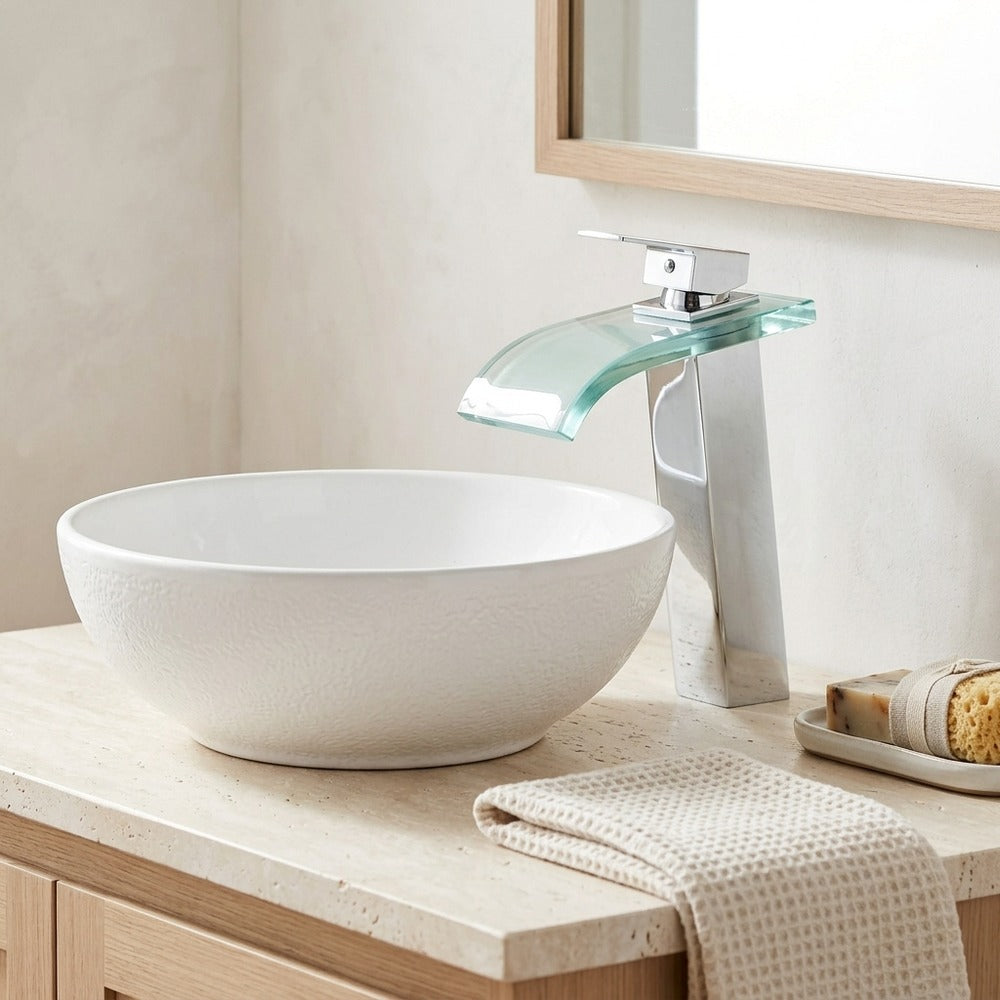 Lagomel single-hole waterfall vessel sink faucet, set in a Modern/Contemporary bathroom