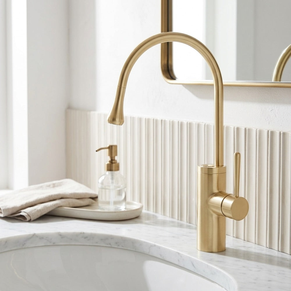 Lagomel single-handle vessel sink faucet in brushed gold, set in a Modern/Minimalist/Contemporary bathroom