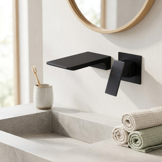 Lagomel waterfall single-handle wall-mount bathroom faucet in matte black, brushed gold, chrome, set in a Contemporary bathroom