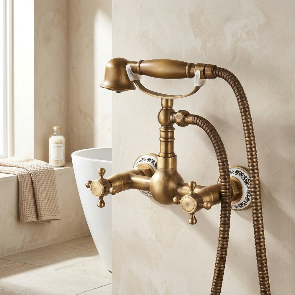 Lagomel wall-mount tub filler in antique brass, set in a Traditional/Classic/Vintage/Retro bathroom