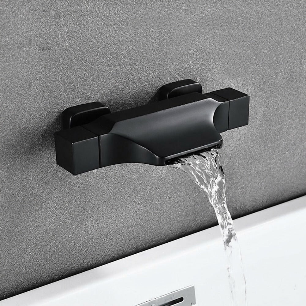 Lagomel waterfall wall-mount tub filler, set in a Modern/Contemporary bathroom