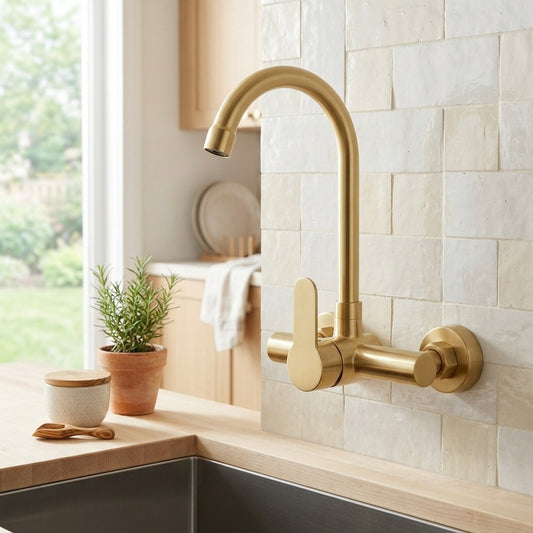 Lagomel single-handle wall-mount kitchen faucet in brushed gold, set in a Modern/Contemporary kitchen