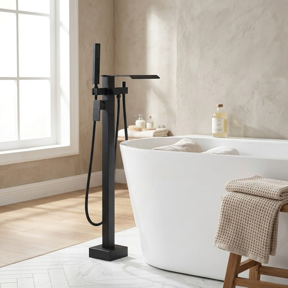 Lagomel waterfall single-handle wall-mount tub filler in matte black, chrome, set in a Contemporary bathroom