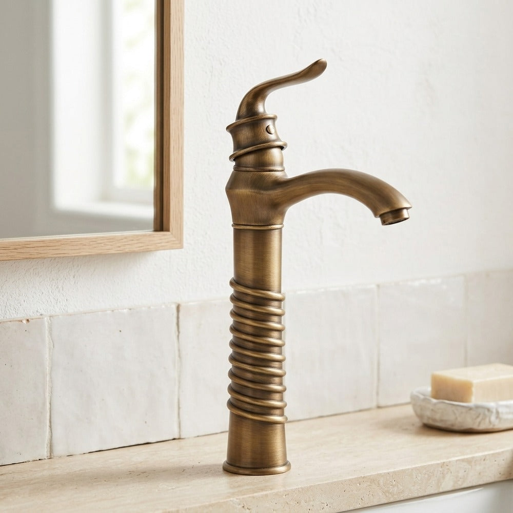 Lagomel single-handle vessel sink faucet in antique brass, set in a Traditional/Classic bathroom