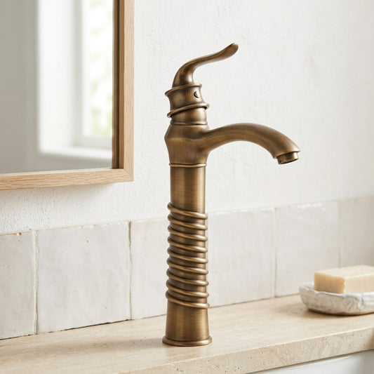 Lagomel single-handle vessel sink faucet in antique brass, set in a Traditional/Classic bathroom