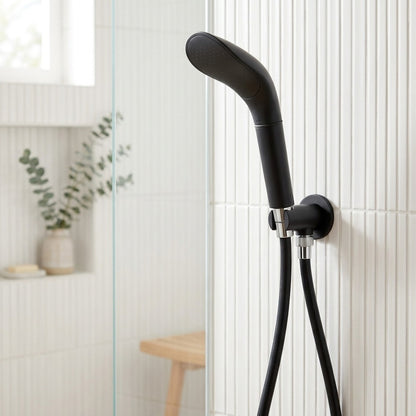 Lagomel wall-mounted hand shower in matte black, set in a Contemporary bathroom