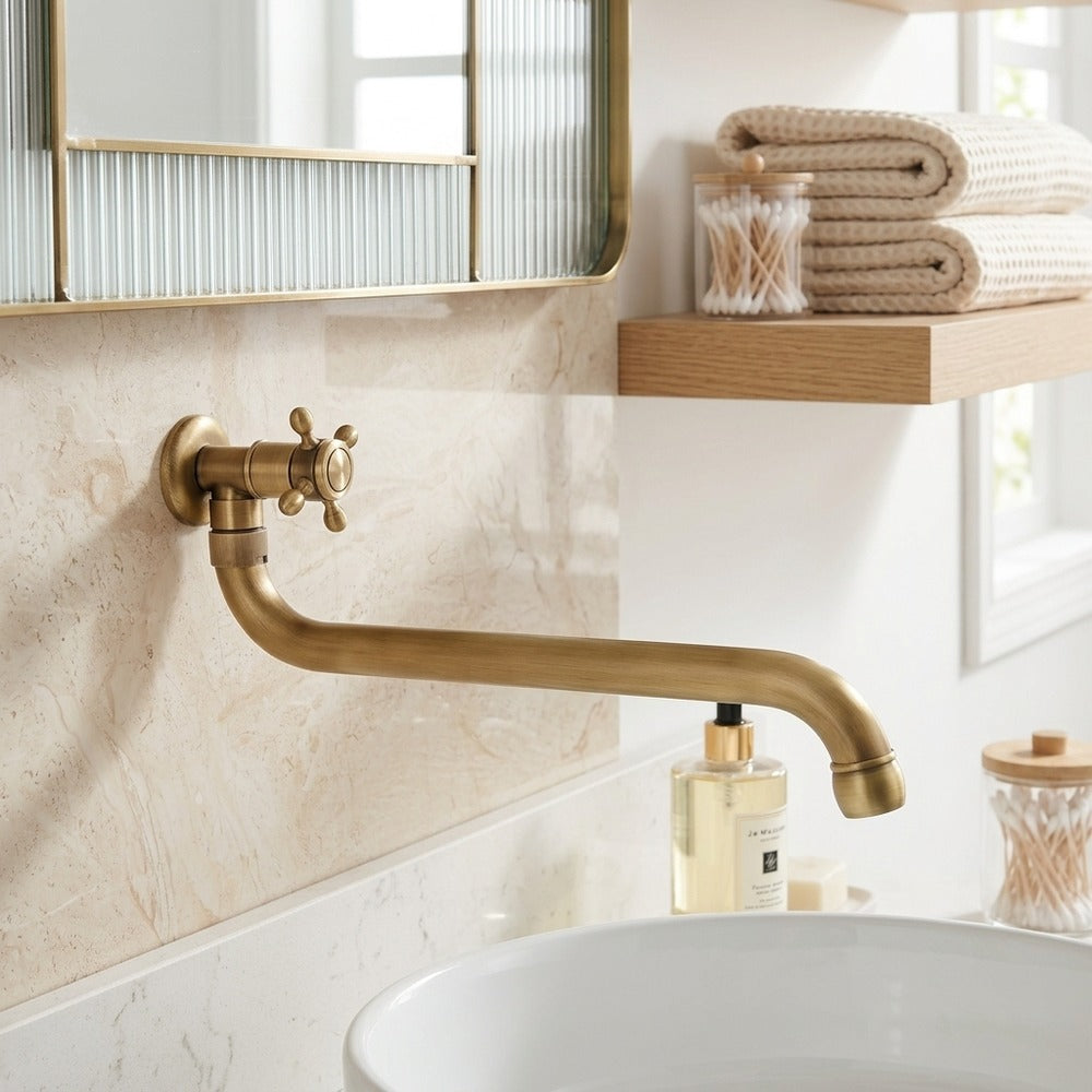 Lagomel wall-mount bathroom faucet in antique brass, set in a Traditional/Classic/Vintage/Retro bathroom