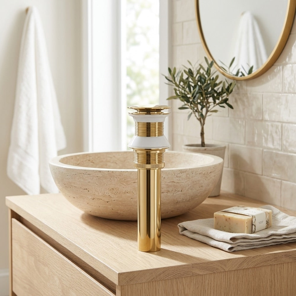 Lagomel bathroom sink drain in polished gold, set in a Contemporary bathroom