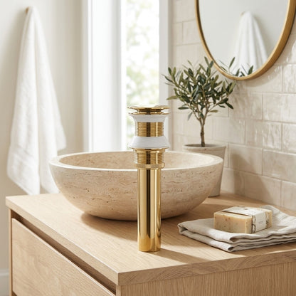 Lagomel bathroom sink drain in polished gold, set in a Contemporary bathroom