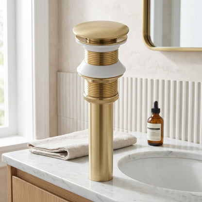 Lagomel bathroom sink drain in brushed gold, set in a Contemporary bathroom