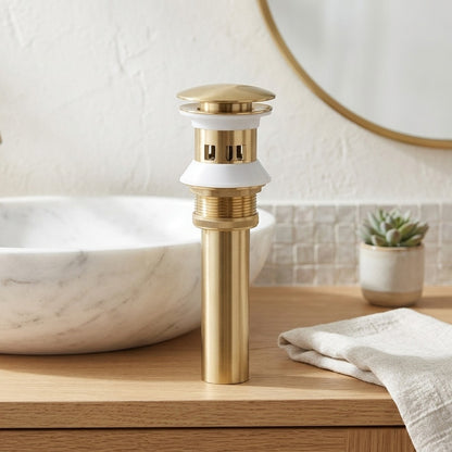 Lagomel bathroom sink drain in brushed gold, set in a Contemporary bathroom