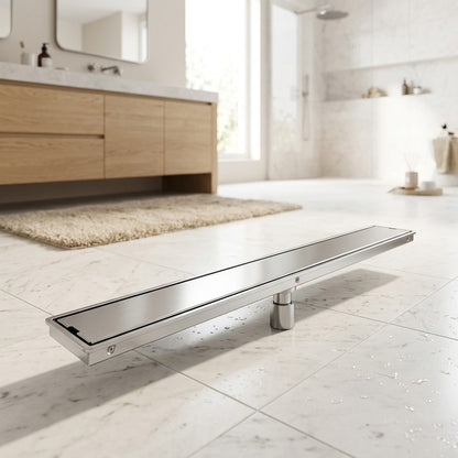 Lagomel linear floor drain, set in a Modern bathroom