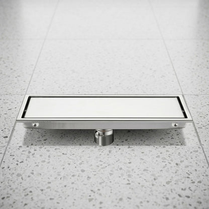 Lagomel linear floor drain in stainless steel, set in a Modern bathroom