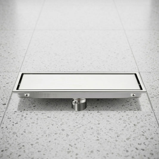 Lagomel linear floor drain in stainless steel, set in a Modern bathroom