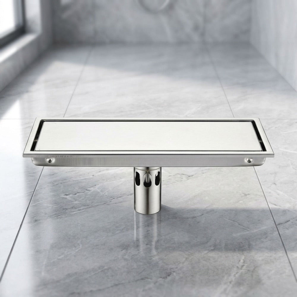 Lagomel linear floor drain, set in a Modern bathroom