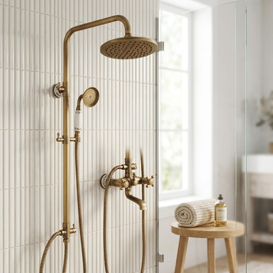 Lagomel wall-mounted double-handle tub and shower system in antique brass, set in a Vintage/Retro/Traditional/Classic bathroom